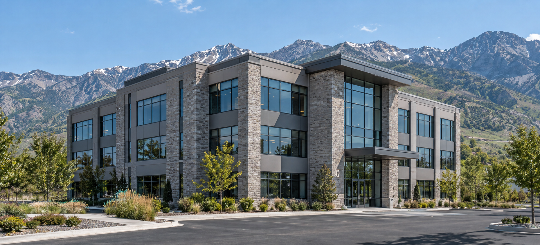 Illustrative commercial office building with a Utah mountain backdrop